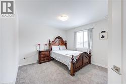 Bedroom with light colored carpet - 