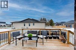 Wooden deck with a residential view and an outdoor living space - 
