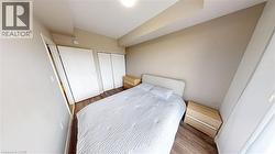 Neutral tone walls featuring wood-finish flooring - 