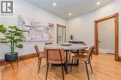 Hardwood flooring throughout featuring recessed lighting and substantial wood trim - 67 Ahrens Street W, Kitchener, ON 