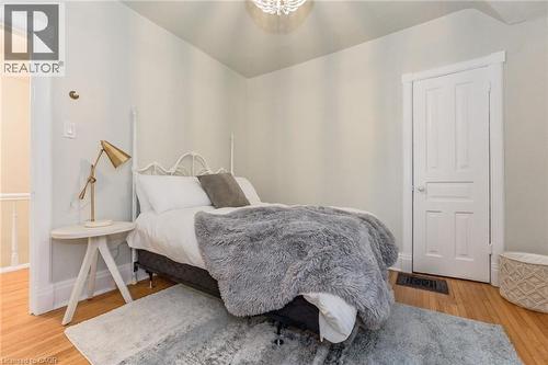Room featuring light-colored walls and wood-finish flooring - 67 Ahrens Street W, Kitchener, ON 