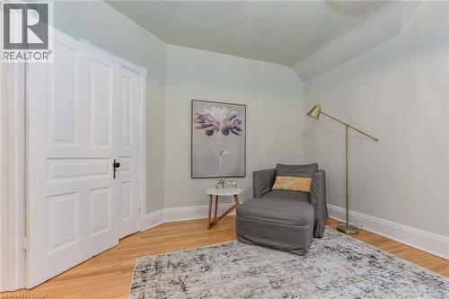 Hardwood flooring complements light-toned walls and classic white trim - 67 Ahrens Street W, Kitchener, ON 