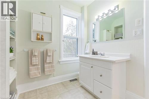 White vanity with an integrated sink and laminate countertop - 67 Ahrens Street W, Kitchener, ON 