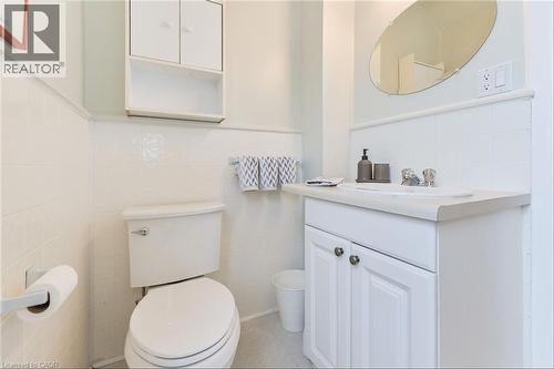 Bathroom vanity with a white countertop and integrated sink - 67 Ahrens Street W, Kitchener, ON 
