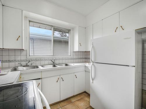 Edmonton, Alberta - Indoor Photo Showing Kitchen With Double Sink