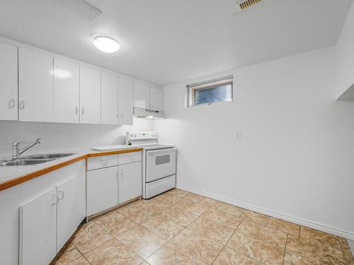 Edmonton, Alberta - Indoor Photo Showing Kitchen With Double Sink