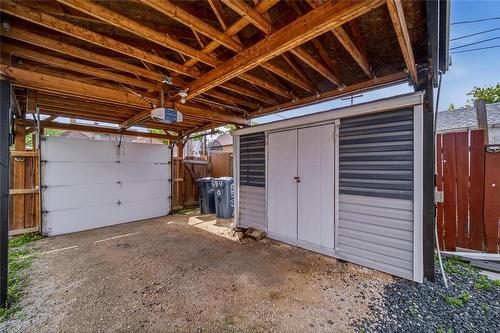 Carport with Overhead Doors - 539 Agnes Street, Winnipeg, MB 