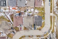 Aerial view of property's location featuring nearby suburban area - 