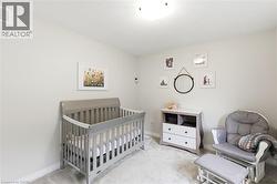 Bright interior space featuring light-colored walls and carpet flooring - 