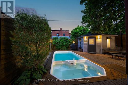 Lap Pool and jacuzzi at dusk . - 119 Strathcona Avenue, Ottawa, ON 