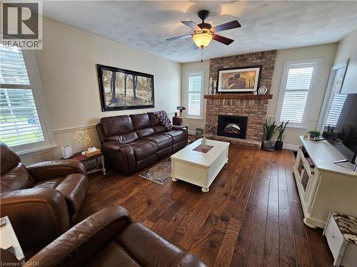 Family room features engineered hardwood, fireplace and walkout to deck - 120 Lynndale Road, Simcoe, ON 