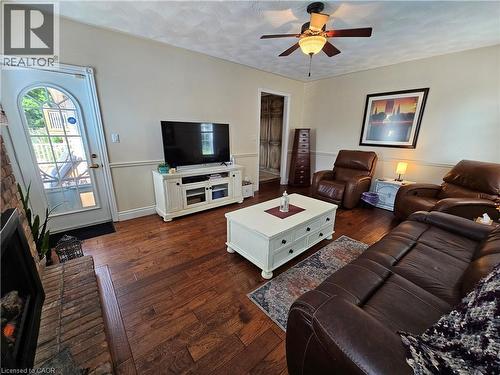 Family room features engineered hardwood, fireplace and walkout to deck - 120 Lynndale Road, Simcoe, ON 