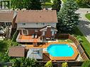 Backyard oasis with an onground pool with integrated wood decking - 120 Lynndale Road, Simcoe, ON 