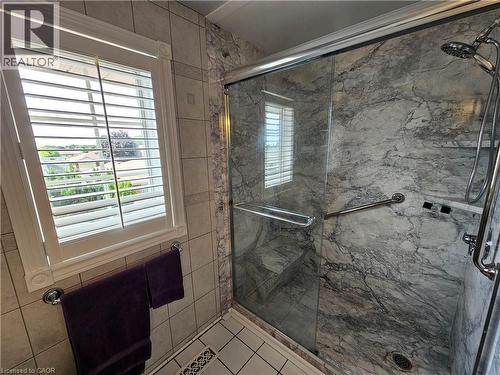 Glass-enclosed shower with marble-look wall tiling - 120 Lynndale Road, Simcoe, ON 