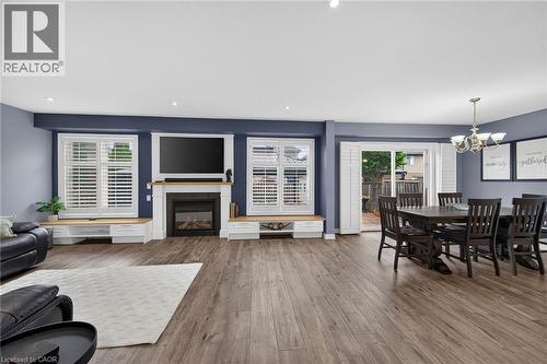 Main floor living room, with gas fireplace, window seats,  potlights and more - 43 Wilbur Drive, Binbrook, ON 