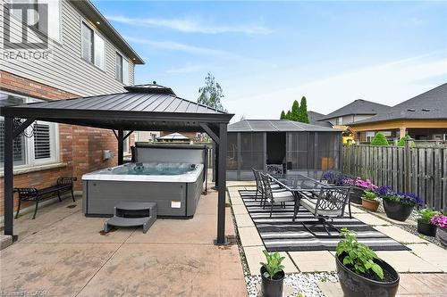 Large hot tub covered with sun safe Gazebo - 43 Wilbur Drive, Binbrook, ON 