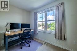 Double-hung window with grilles, offering natural light - 