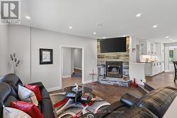 FULL HEIGHT STONE FIREPLACE WITH RAISED HEARTH - 