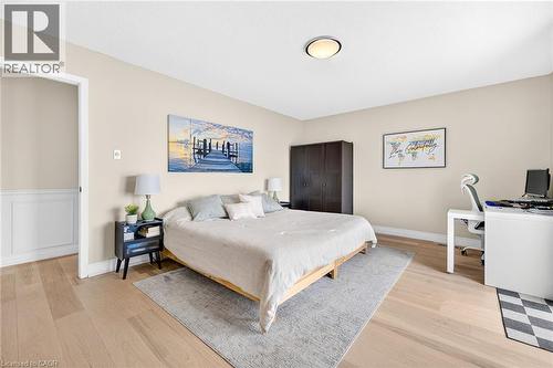 Spacious room featuring light wood-finish flooring, neutral wall tones, and recessed lighting - 15 Cheval Drive, Grimsby, ON - Indoor Photo Showing Bedroom