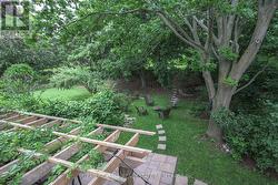 Deck overlooking hottub and treed yard - 