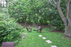 Private treed Yard - lot ends bottom of the hill - 