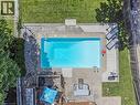 Rectangular swimming pool with integrated steps, surrounded by concrete decking - 139 Dorset Road, Cambridge, ON 