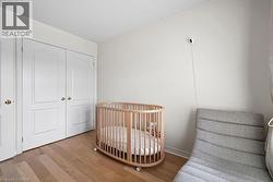 Light wood-finish flooring complements the neutral wall color - 