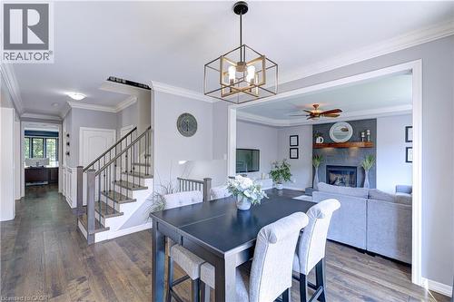 Open concept interior with wide plank wood-finish flooring throughout - 1406 Marshall Crescent, Milton, ON 