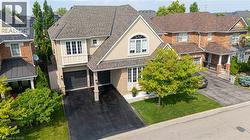 Two-story residence featuring a combination of brick and stucco siding - 
