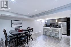 Open-concept living space with recessed lighting and wood-finish flooring - 
