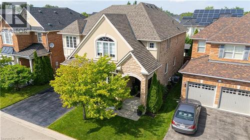Stone and stucco facade with an arched entry - 1406 Marshall Crescent, Milton, ON 