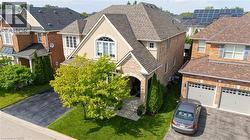 Stone and stucco facade with an arched entry - 