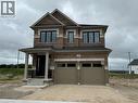 Two-story brick exterior featuring stone accents and a two-car garage - 10 Guernsey Drive Unit# Upper, Kitchener, ON 