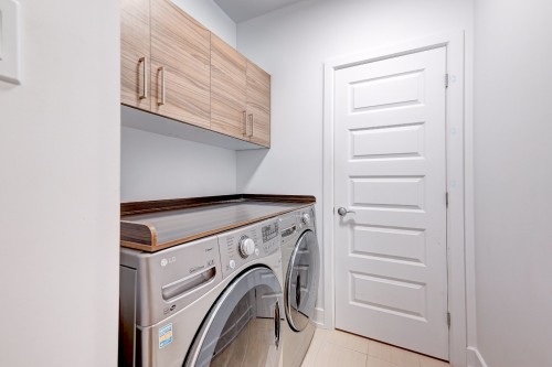 Salle de lavage - 102-56 Rue St-Pierre, Saint-Constant, QC - Indoor Photo Showing Laundry Room
