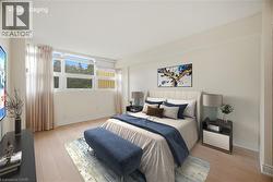 Bedroom featuring light-tone wood-finish flooring, white baseboards, and a large window with sheer drapery - 