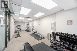Dedicated fitness area featuring a diverse selection of exercise equipment, including cardio machines and free weights - 