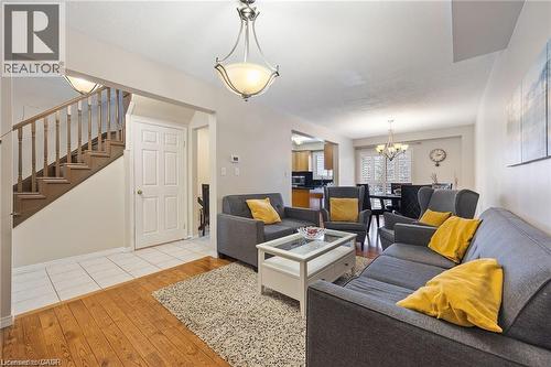 Hardwood flooring and tile entry - 125 Terni Boulevard, Hamilton, ON - Indoor Photo Showing Living Room
