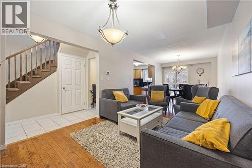 Inviting living area featuring wood-finish flooring, a neutral color palette, and an open layout - 125 Terni Boulevard, Hamilton, ON 