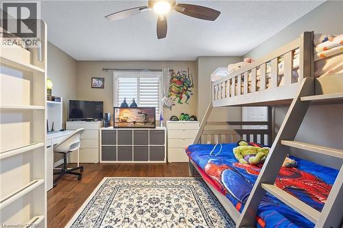 Hardwood-finish flooring featuring a decorative area rug - 125 Terni Boulevard, Hamilton, ON 