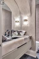 Floating vanity with a thick stone countertop and integrated sink - 