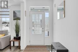 Front Entry with Natural Light Pouring Through - 