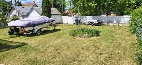 Yard with plenty of space for a large garage or shop - 23 Princess Avenue E, Brandon, MB 