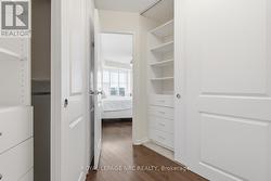 Primary Bedroom  walk-in closet with closet design - 