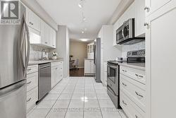 Modern Kitchen shows appliances & annex to kitchen - 