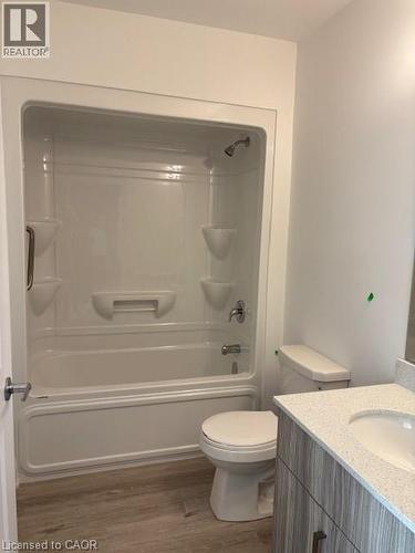 Full bathroom featuring a white tub and shower combination with chrome fixtures - 1936 Rymal Road E Unit# 516, Hannon, ON - Indoor Photo Showing Bathroom