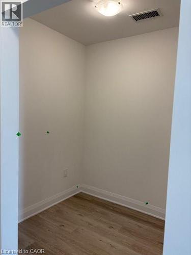 Recessed alcove with light wood-finish flooring, white baseboards, and light wall finishes - 1936 Rymal Road E Unit# 516, Hannon, ON - Indoor Photo Showing Other Room