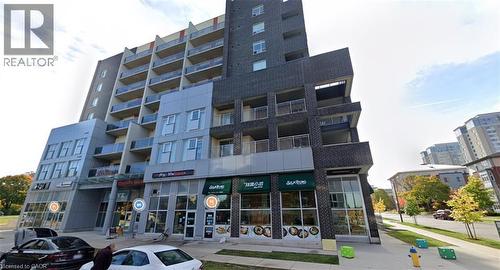 Modern multi-story building featuring a facade of dark brick and light grey panels - 280 Lester Street Unit# 607, Waterloo, ON 