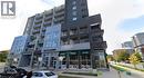Modern multi-story building featuring a facade of dark brick and light grey panels - 280 Lester Street Unit# 607, Waterloo, ON 