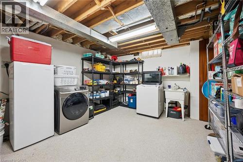 Laundry area featuring a utility sink and white walls - 2 Keewatin Avenue, Kitchener, ON 