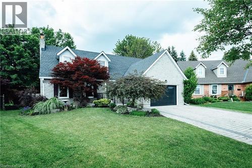 Brick and siding exterior featuring a multi-gable roofline with dormer windows - 28 Mcgibbon Court, Kitchener, ON 